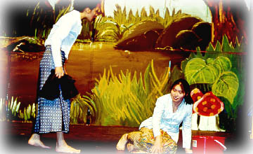 The evil mother torturing her step daughter, Bawang Putih (Jennifer)